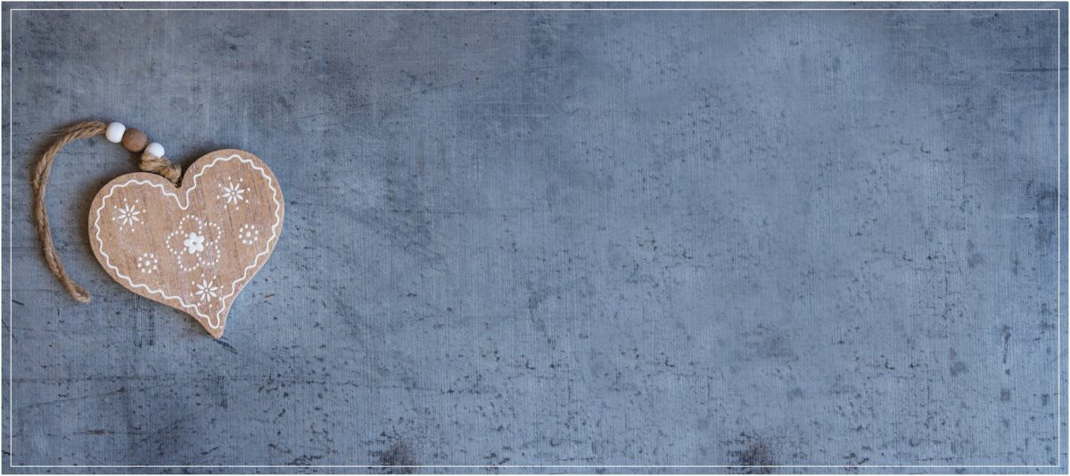 brown heart pendant on grey surface