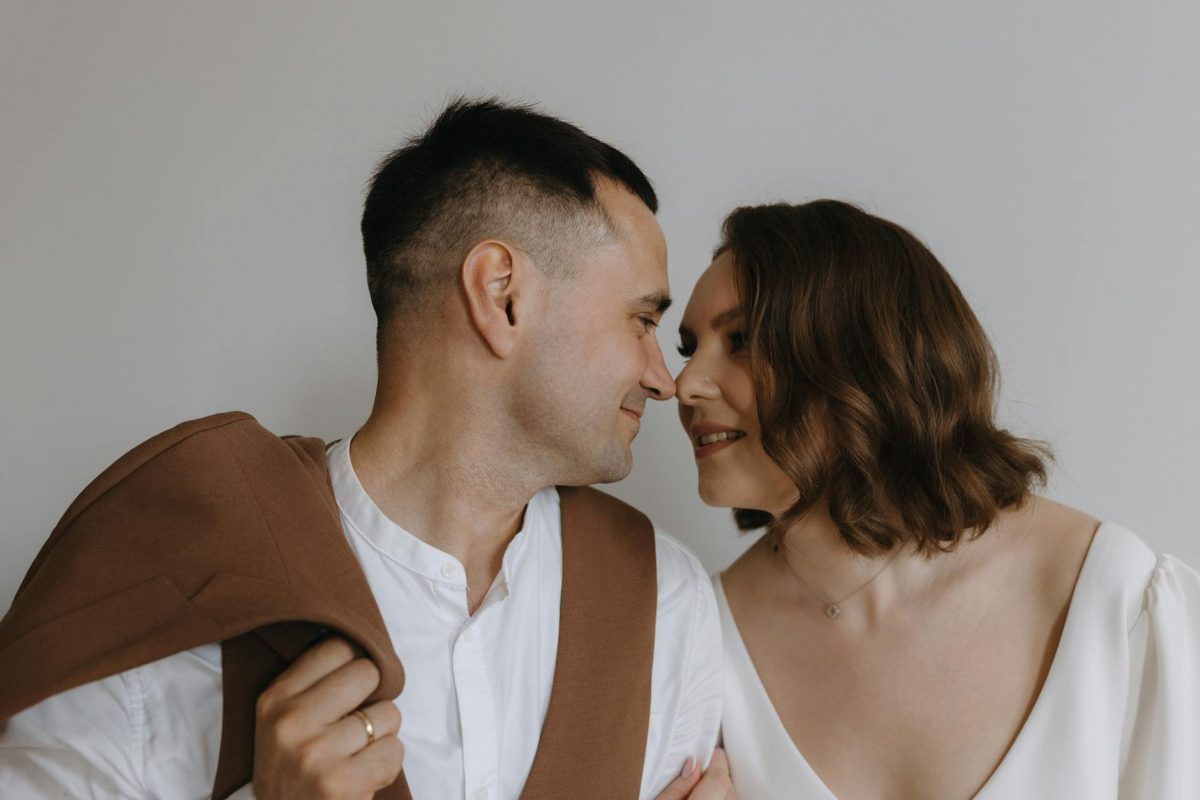 romantic couple gazing lovingly in minimalist setting