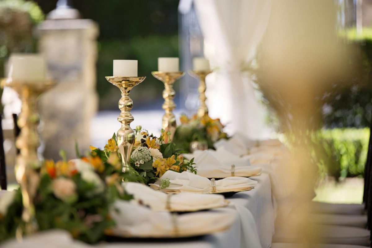 selective focus of candlesticks on table with wedding set up